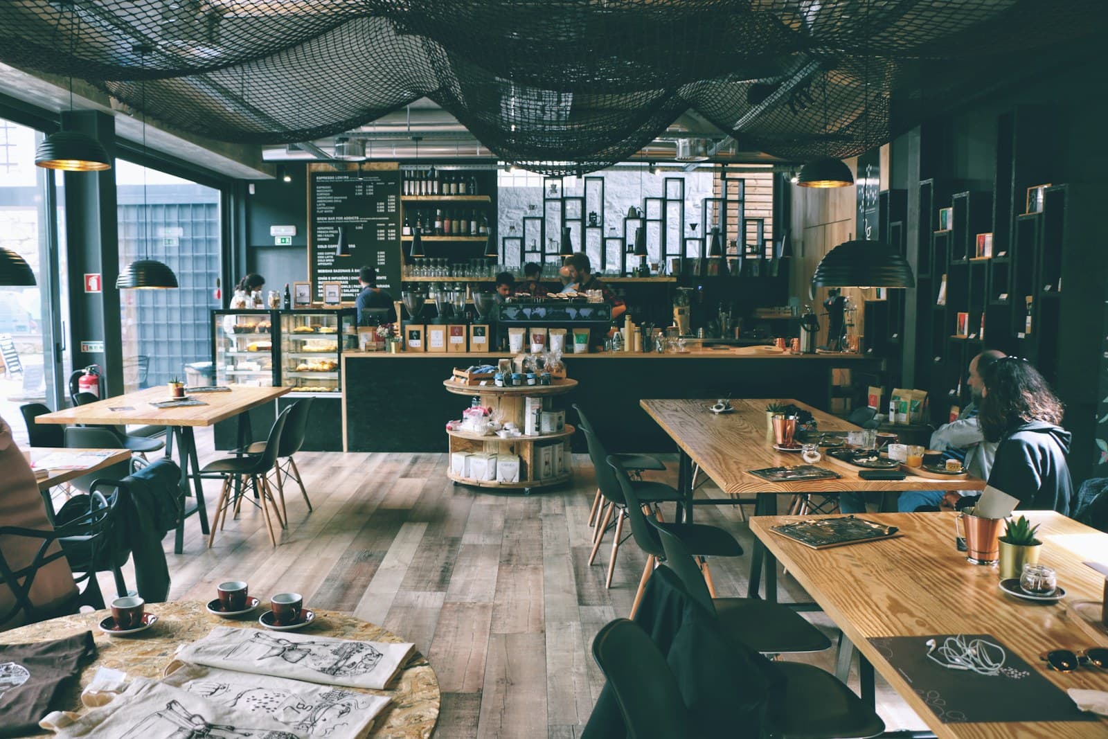 Warm wooden tables and big windows inside Cafe Baguio on a slow afternoon